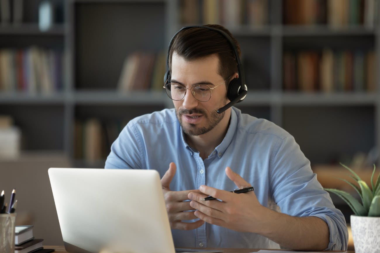 Man at Computer with Headset