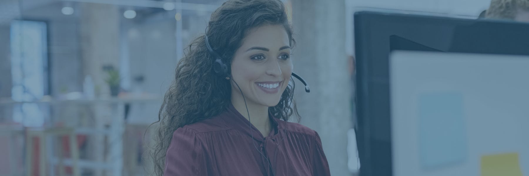 Smiling Woman with Headset Using Zoom