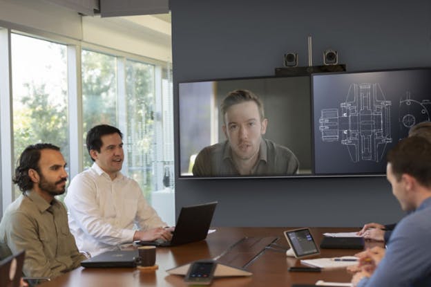 People at Desk in Video Conference